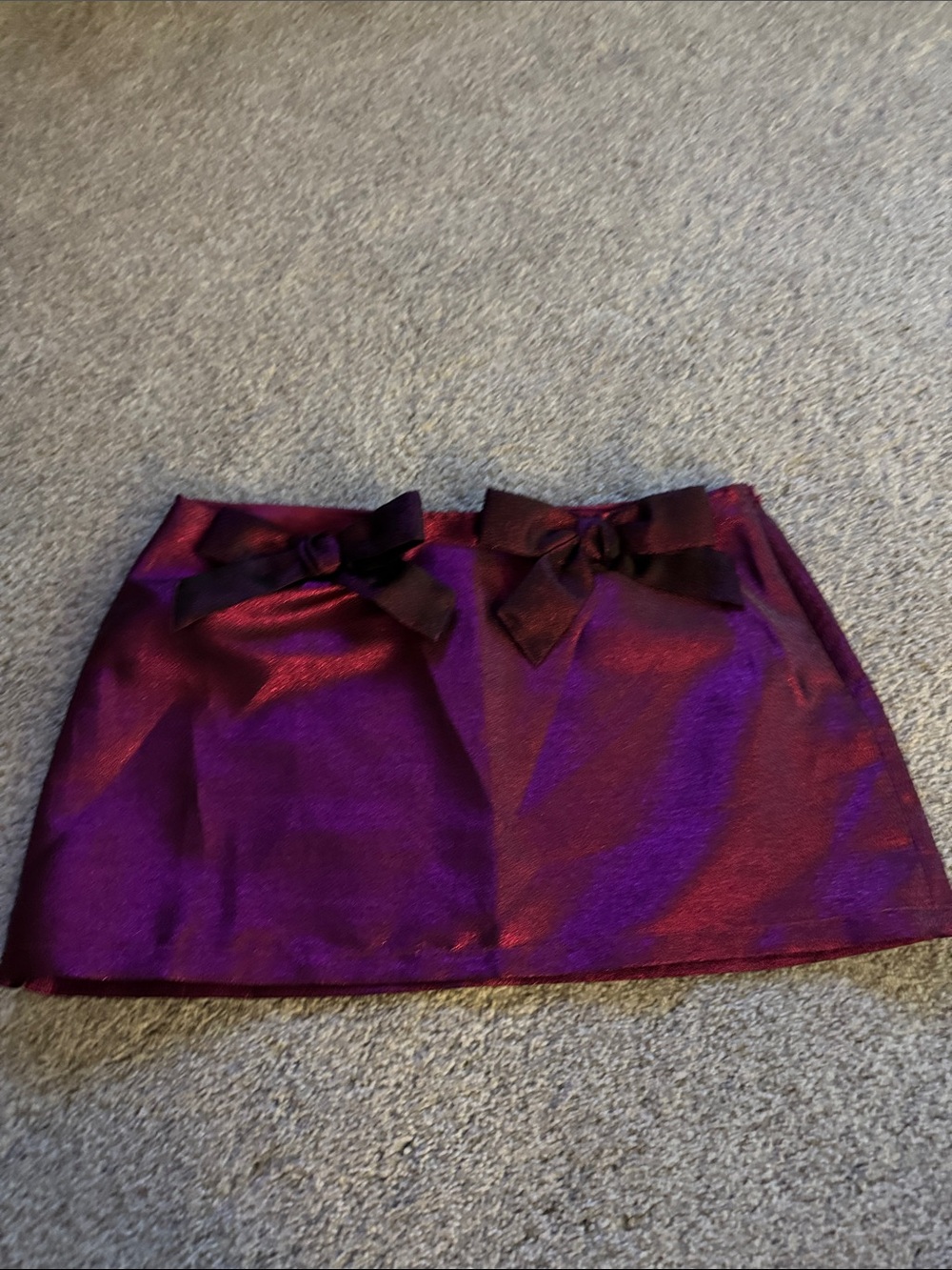 Urban Outfitters Shimmery Purple Mini Skirt with Dual Bow Accents